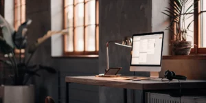 Virtual receptionist workspace with headset and computer.