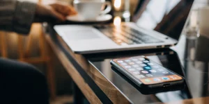 Business call app on smartphone and laptop.
